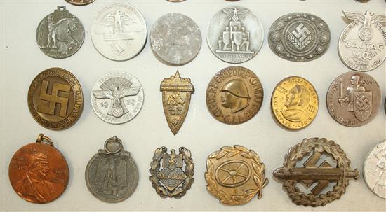 A large collection of various German Third Reich badges,